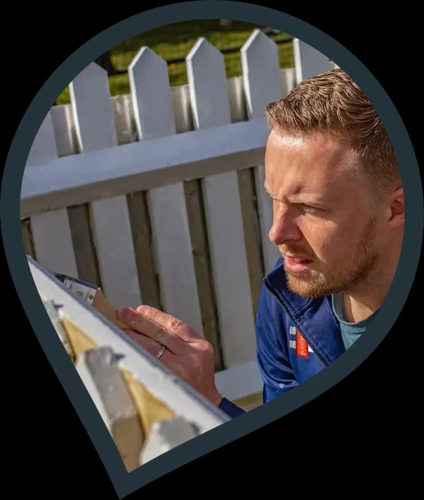 fencing contractor fixing a fence