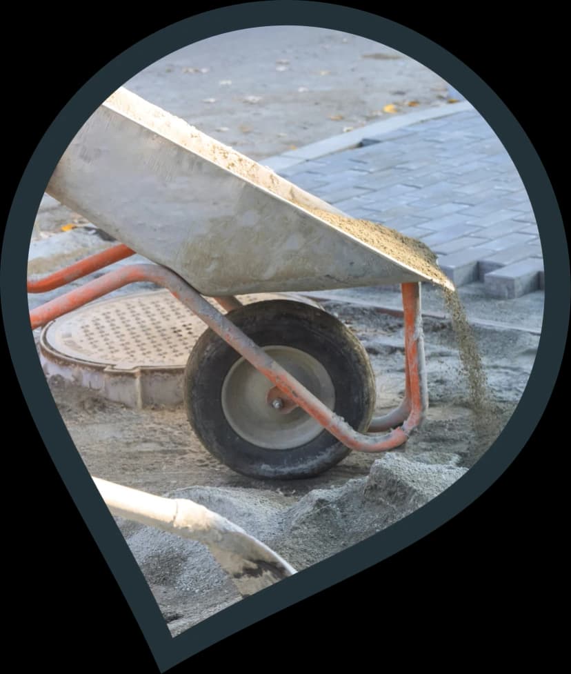 installer creating cement mix for block paving driveway installation