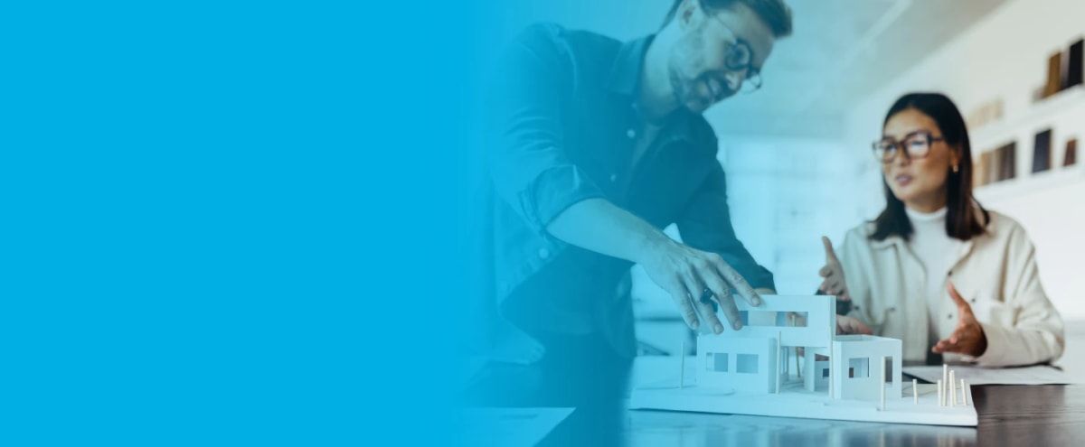 Two residential architects adjusting and conversing over a conceptual design