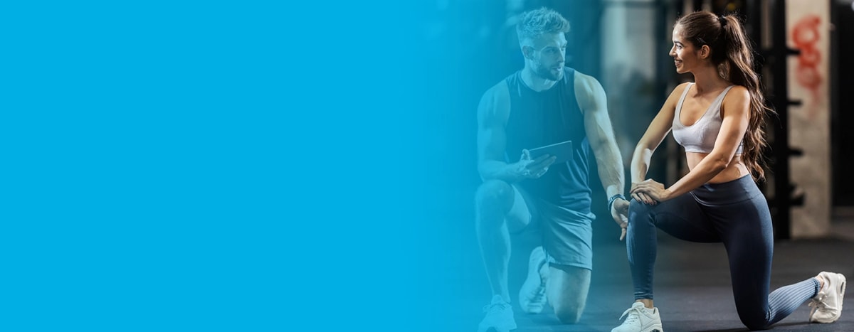 Personal trainer is showing a customer how to do correct lunges