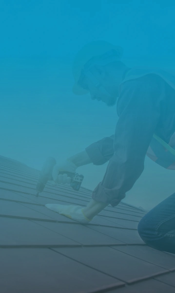 Professional roofers roofing a new build with ceramic roof tiles